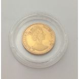 A 1988 gold angel coin (3.