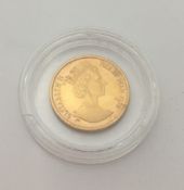A 1988 gold angel coin (3.