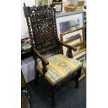 A 17th century style carved oak armchair