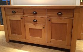 A modern oak sideboard. 157 cm wide; 84 cm high, 45 cm deep.