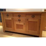 A modern oak sideboard. 157 cm wide; 84 cm high, 45 cm deep.