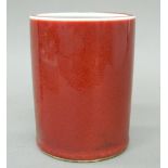A Chinese sang de boeuf red porcelain brush pot