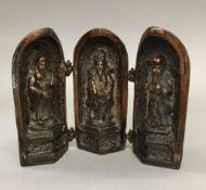 A bronze triptych shrine