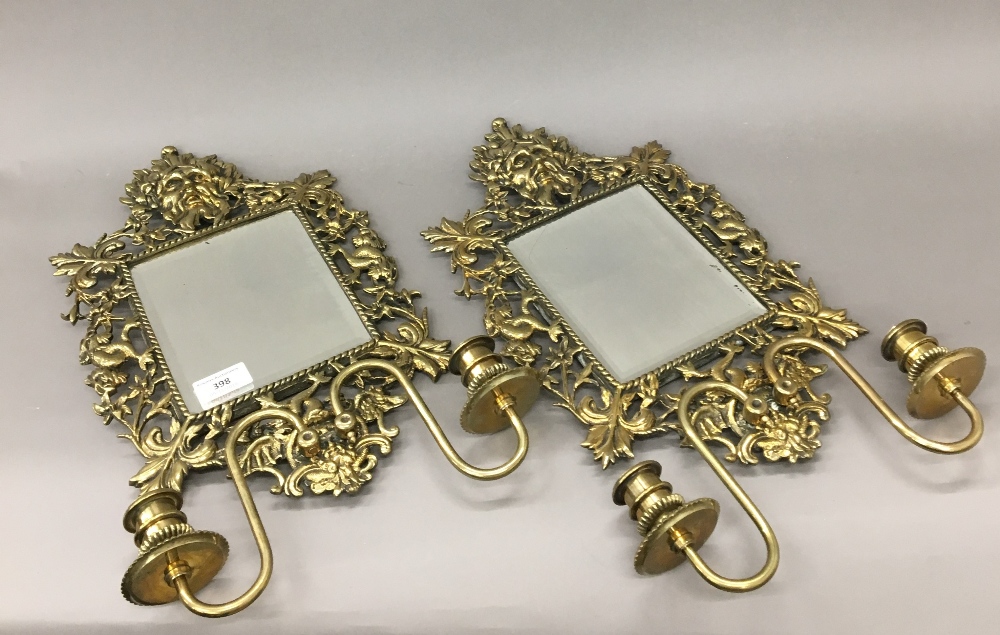 A pair of 19th century cast brass girandoles