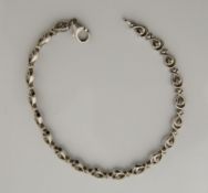 A silver and diamond 'tennis' bracelet