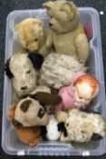 A collection of vintage plush covered toys and a doll