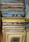 A collection of postcards, some mounted in albums,