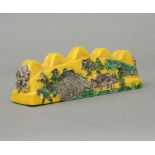 A Chinese yellow porcelain brush rest