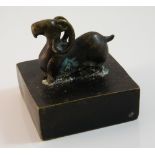 A bronze seal decorated with a ram