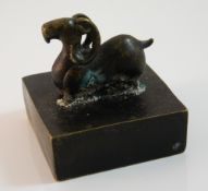 A bronze seal decorated with a ram