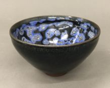 A Chinese Song Dynasty style Jun Ware type bowl. 7 cm high; 12.25 cm diameter.