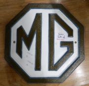 A cast iron M G plaque