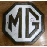 A cast iron M G plaque