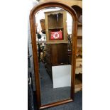 A full length Victorian bevelled mirror