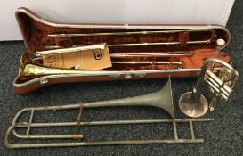 A cased Olds Ambassador trombone, a trumpet, etc.