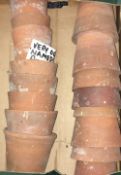 A quantity of small vintage terracotta flowerpots