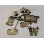 A collection of wine labels and thimbles