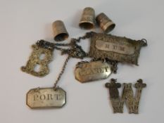 A collection of wine labels and thimbles