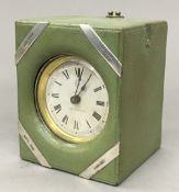 A silver mounted leather cased desk clock