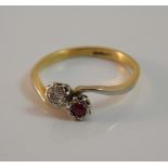A 1940s 18 ct gold diamond and ruby crossover ring (2.