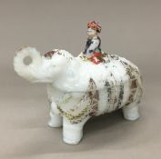 A opaline glass and painted elephant form box