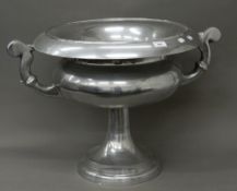 A large aluminium urn