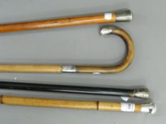 Four silver mounted walking sticks