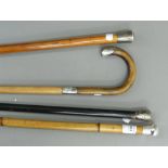 Four silver mounted walking sticks