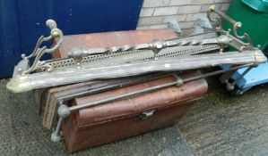 Three brass fenders and various fire irons