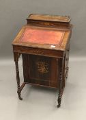 A Victorian inlaid rosewood Davenport