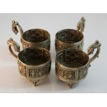 A set of four Chinese silver cup holders