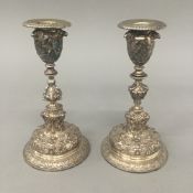 A pair of Elkington silver plated candlesticks