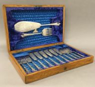 A cased set of silver plated fish cutlery