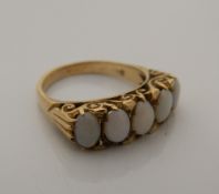 A 9 ct gold five stone opal ring (5.