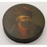 A 19th century papier mache snuff box depicting a Russian gentleman