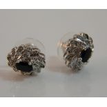 A pair of diamond and sapphire earrings