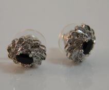 A pair of diamond and sapphire earrings