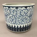 A 19th century Chinese porcelain blue and white jardiniere. 28 cm diameter.