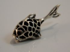 A silver pin cushion in the form of a fish