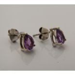 A pair of silver and amethyst earrings