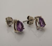 A pair of silver and amethyst earrings