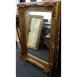 A gilt framed mirror