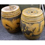 A pair of Oriental pottery garden seats decorated with dragons