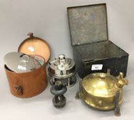 A vintage leather cased camping stove and another