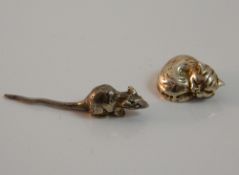 A miniature silver cat and mouse