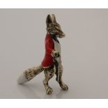 A silver model of a fox. 3.5 cm high.