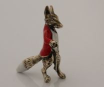 A silver model of a fox. 3.5 cm high.