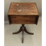 A 19th century mahogany twin flap pedestal Pembroke table