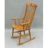 A Victorian elm seated splat back rocking chair