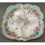 A Continental porcelain entree dish, the four section florally painted,